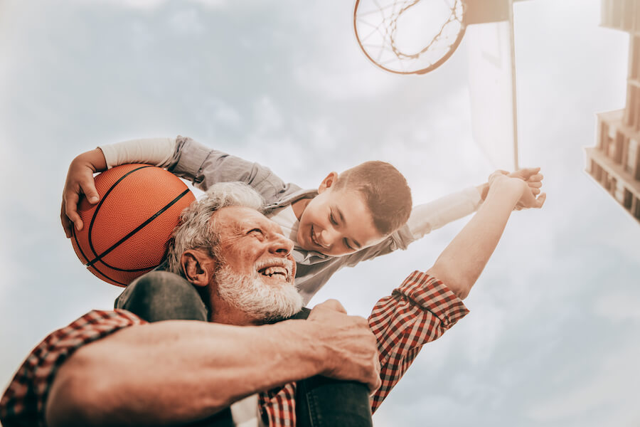 Grandparent and child with basketball